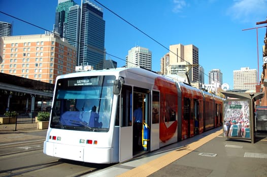 train in sydney, buildings in background, logos and advertisements removed