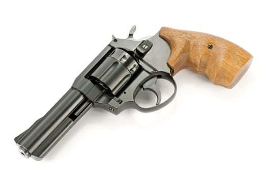 revolver gun with wooden handle , over white background