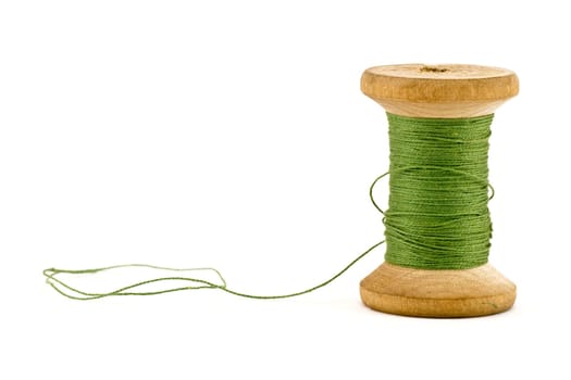 green thread spool , isolated on white background