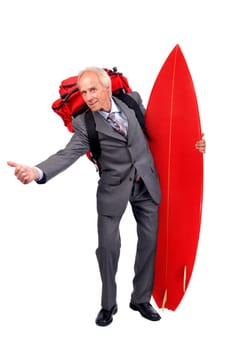 Mature businessman hitchhiking with backpack and surf board