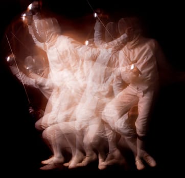 Male fencer isolated in a dark background