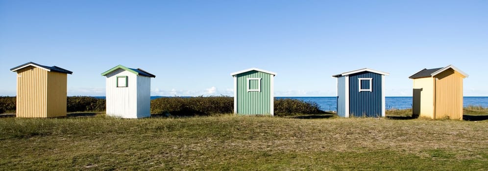 Row of boathouses on a sunny day