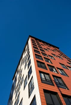 Orange Building Exterior towards Blue sky
