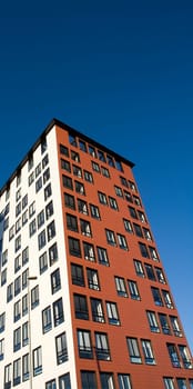 Orange Building Exterior towards Blue sky