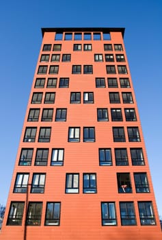 Orange Building Exterior towards Blue sky