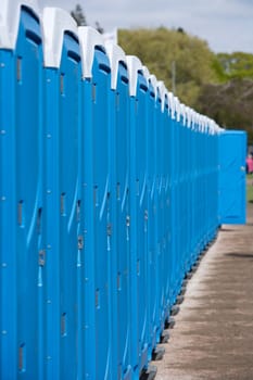 Row of Blue Portable Toilets