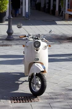 Gray scooter parked in the pedestrian zone