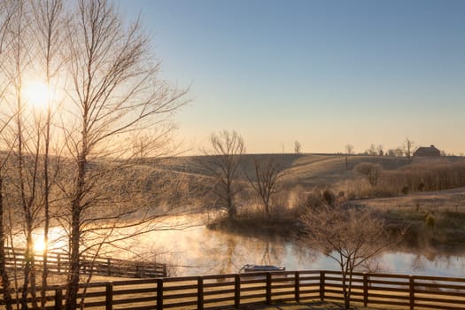 Sunrise on a frosty morning over a small lake in central Kentucky