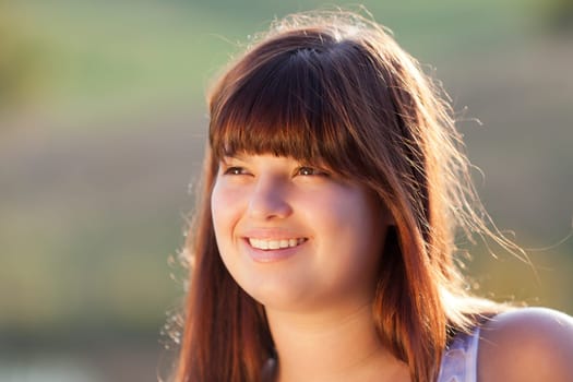 Outdoors portrait of a beautiful young lady