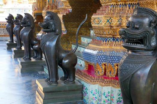 Row of lion statures in Grand Palace in Bangkok, Thailand