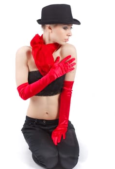 Young attractive woman with red gloves and black hat.