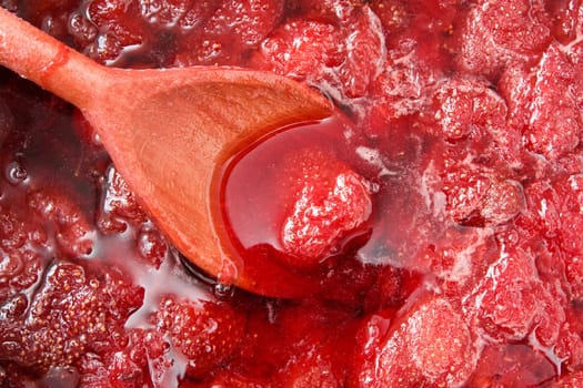 wooden spoon in a home made strawberry jam