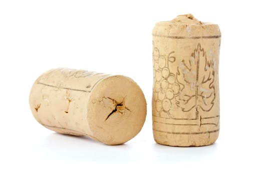 Two corks from wine bottles on white background