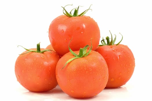 heap of fresh tomatoes on white background