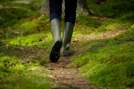 Boots in the forest from behind