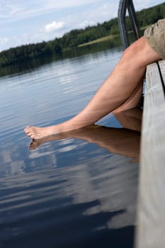 Man with feet in the water
