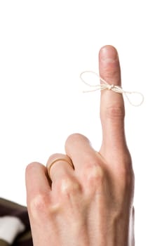 Reminder on the finger isolated on white background