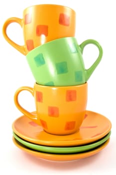 three colorful cups on a white background