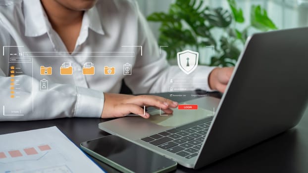 Businesswoman using computer to login represents protection concept of cyber security and data security including secure login.