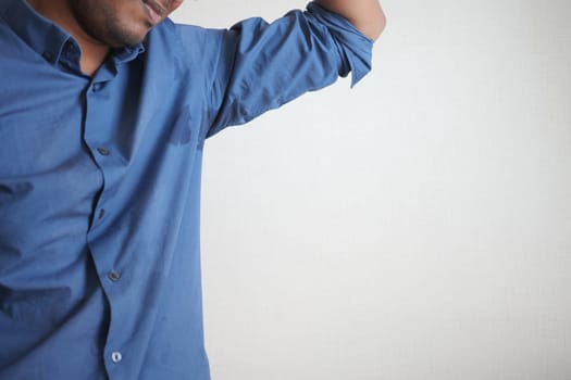 man with wet armpits Smelly odor from sweat