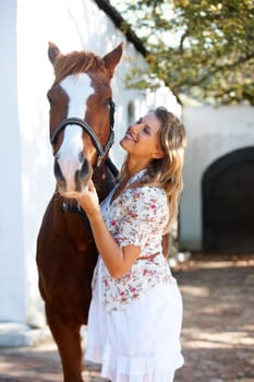 Happy, love and young woman with her horse on an outdoor farm for sports racing at ranch. Smile, training and confident female person from Canada with her equestrian animal or pet in countryside