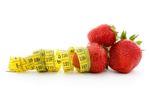 Strawberries with measure tape isolated on white