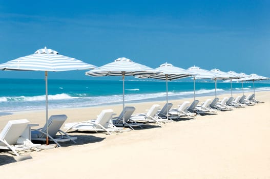Panoramic view of chairs and nices umbrella on the beach