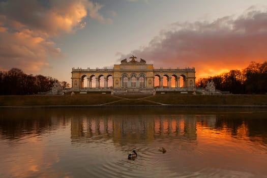 Gloriette Vienna,building and landmark in front of pond with sunset