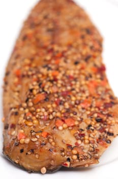 Smoked mackerel with pepper on a plate