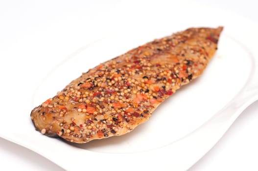 Smoked mackerel with pepper on a plate