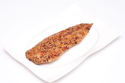 Smoked mackerel with pepper on a plate