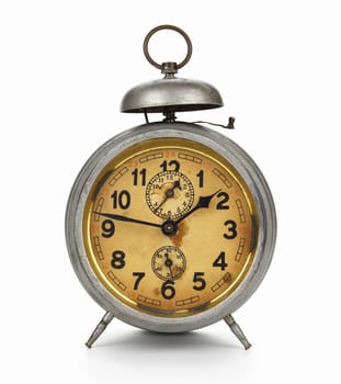 Old silver clock with gold plated face, isolated on white background