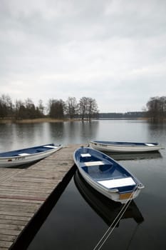 Anchored rowboats by a pyer at Trakai