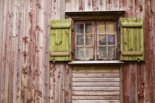 Old wooden window with shutters