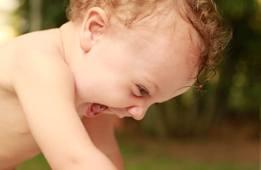 happy the child looks into the camera