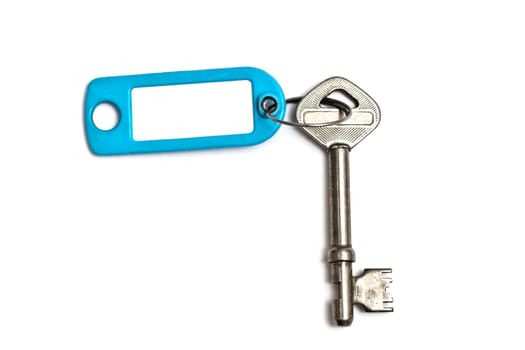 Blank tag and old key isolated on white background