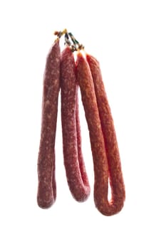 Italian salami sausages closeup on white background