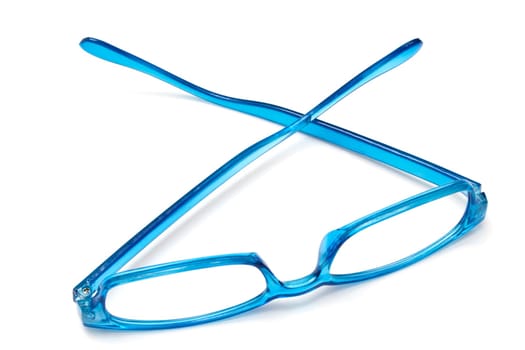 Beautiful blue glasses closeup on white background