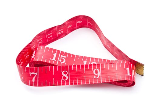Red tape measure closeup on white background
