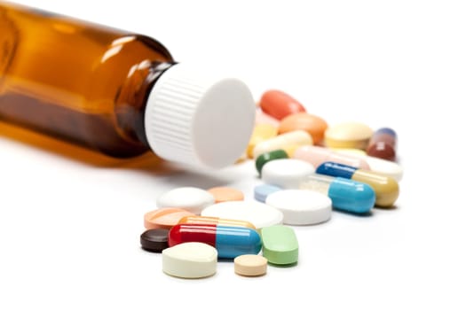 Tablets,different pills in different colors against white background