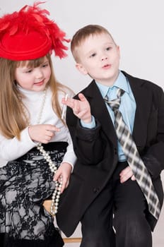 boy smokes a cigarette and a girl looks at him