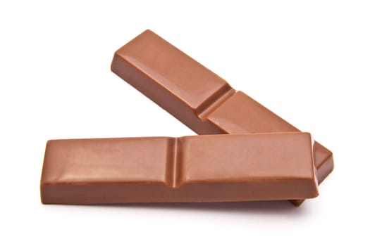 Delicious chocolates closeup on white background