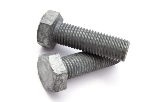 Two big bolts closeup on white background