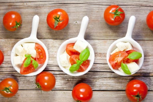 Italian salad with tomatos and mozarella cheese
