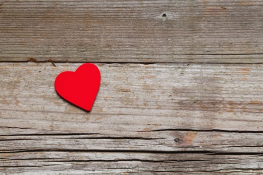 A heart on wooden background