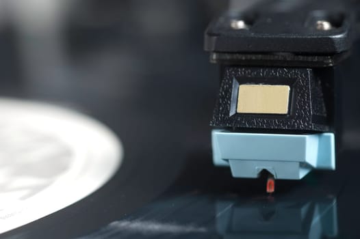 Close up of Record Player with Focus on Arm and Needle.