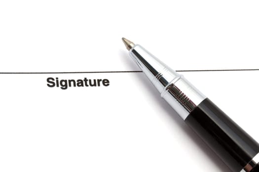 Pen isolated on a blank signature paper