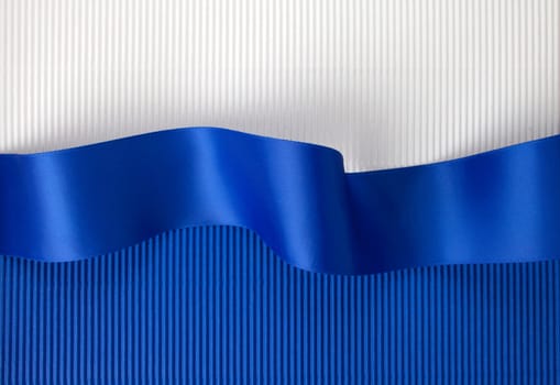 Blue ribbon banner on corrugated cardboard
