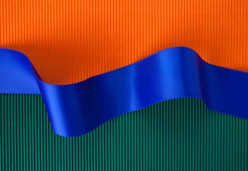 Blue ribbon banner on corrugated cardboard