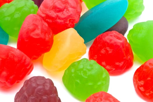 Colorful fruits candy closeup on white background